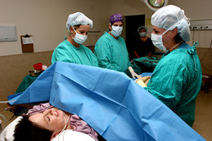 Photo of a woman undergoing a caesarean section