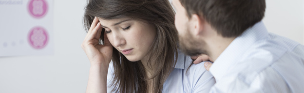 Photo of a worried couple, hypnotherapy may help cope with high risk pregnancy